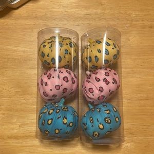 Two sets of three leopard print pumpkins